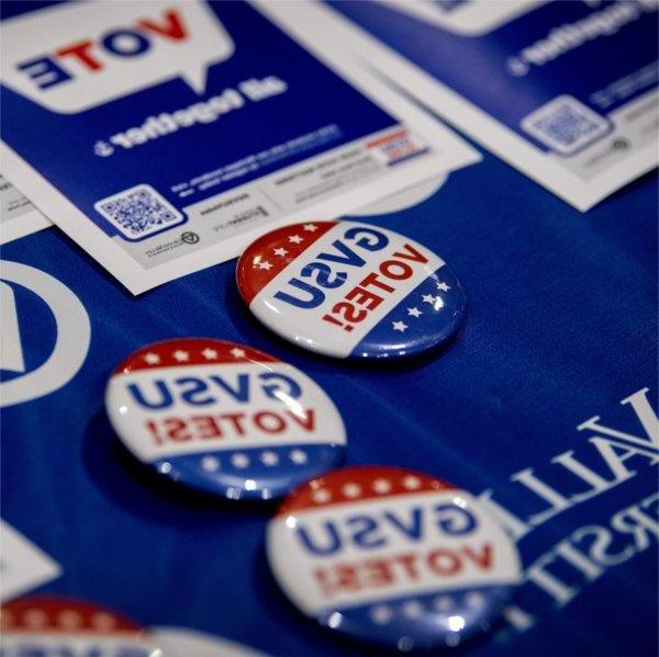 Closeup photo of buttons reading, 'GVSU Votes!'